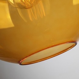 Lámpara colgante moderna de cristal con pantalla de cristal redonda con diseño de burbujas de color ámbar.
