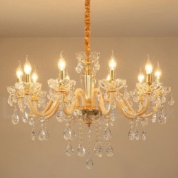 Candelabro dorado con candelabro de cristal transparente