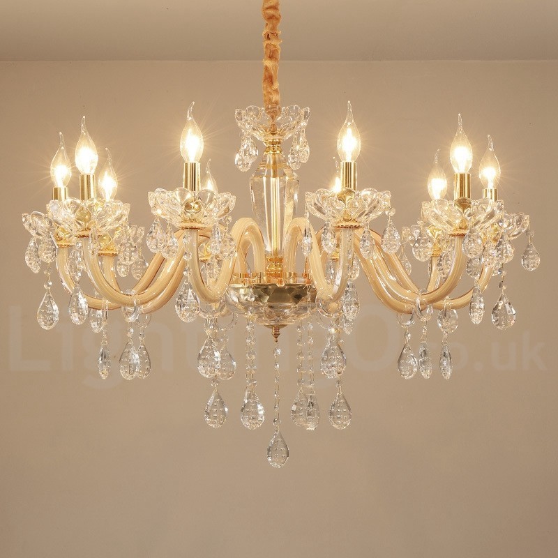 Candelabro dorado con candelabro de cristal transparente
