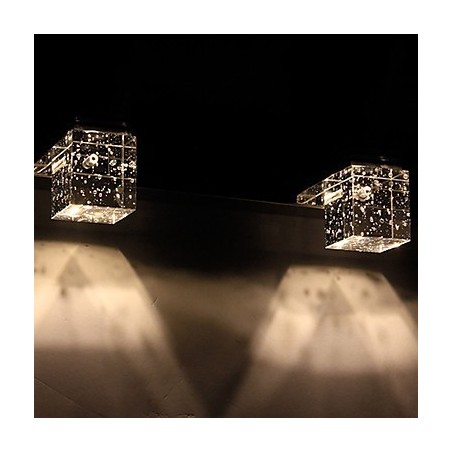 Lámpara de pared moderna con pantalla cúbica de burbujas de vidrio y espejo frontal.