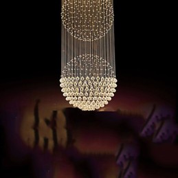 Lámpara colgante moderna de cristal de 12 luces con dosel plateado y globo de cristal transparente.